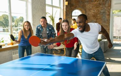 young-people-playing-table-tennis-in-workplace-having-fun (1)